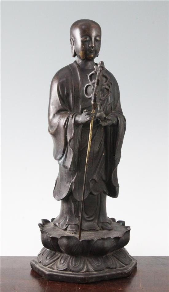 A Chinese bronze figure of Xuangzang, possibly 19th century 37cm